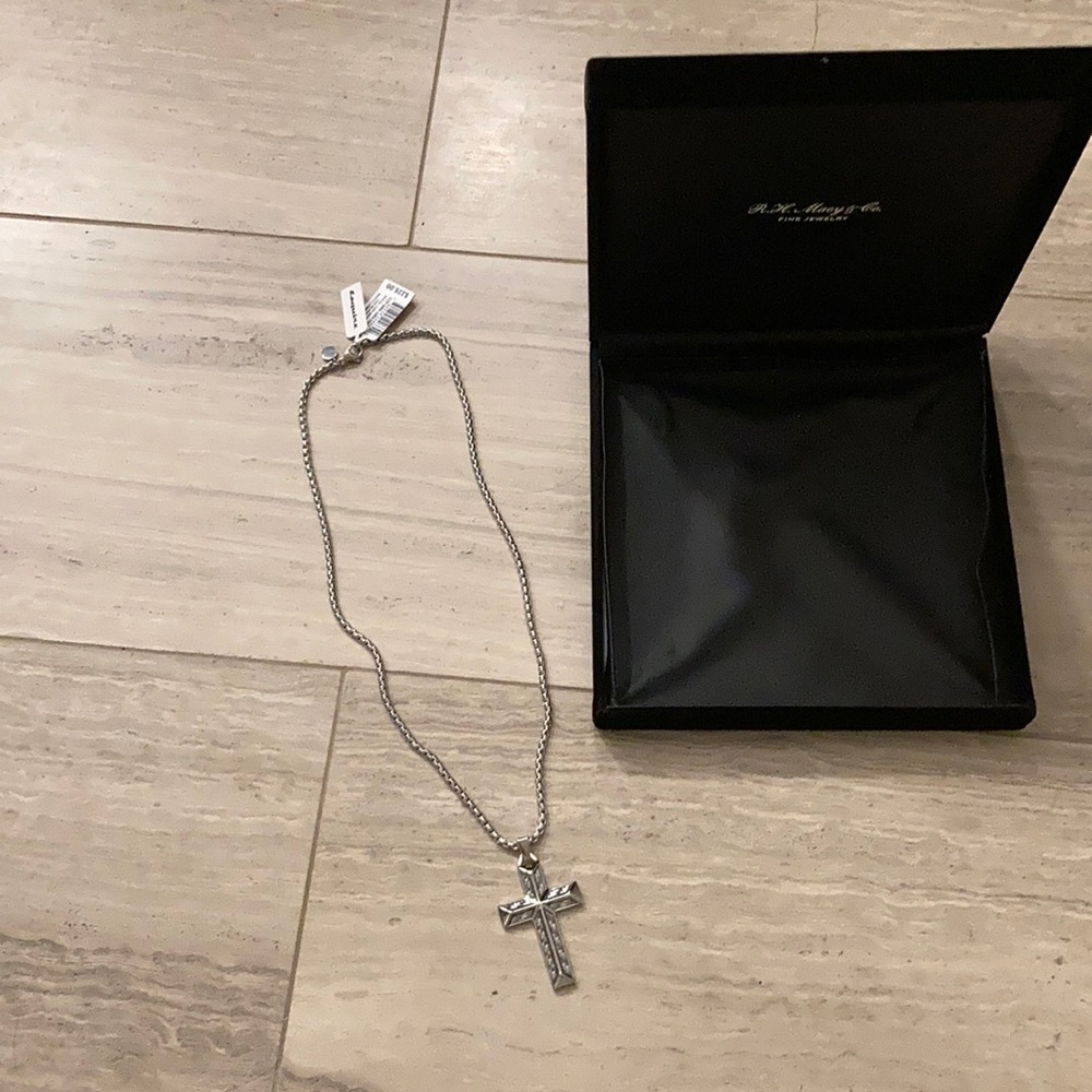 Men’s jewelry. Gray white cross pendant.